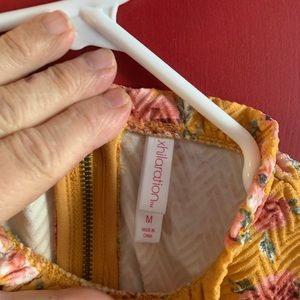 Women’s floral print sleeveless knit dress. Mustard color